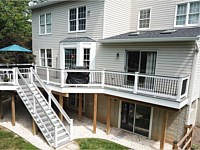 <b>Trex Transcend Island Mist Composite Deck Boards with White Washington Vinyl Railing with round aluminum balusters and a matching drink rail 1</b>